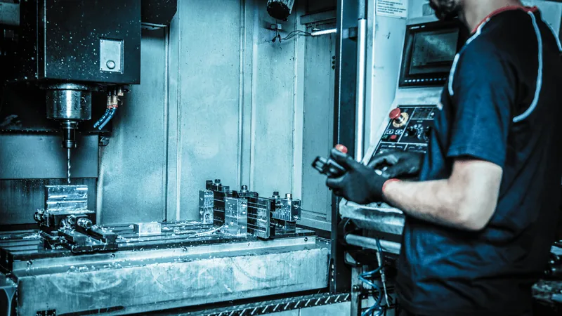 Chart showing the cascade of costs from unplanned CNC machine tool downtime in a manufacturing facility.